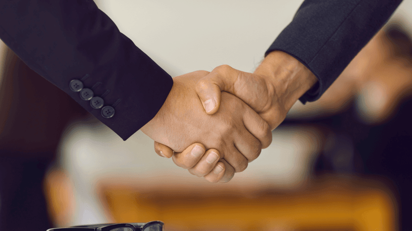 Handshake between two people in business setting